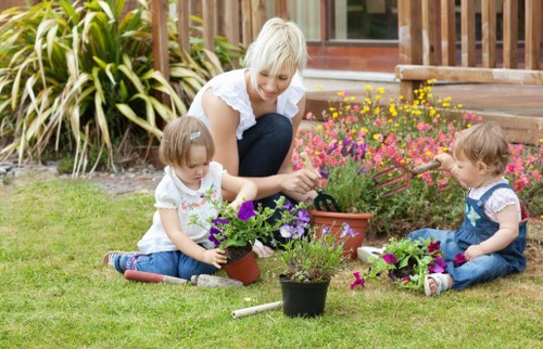 Operator using garden machinery with protective equipment